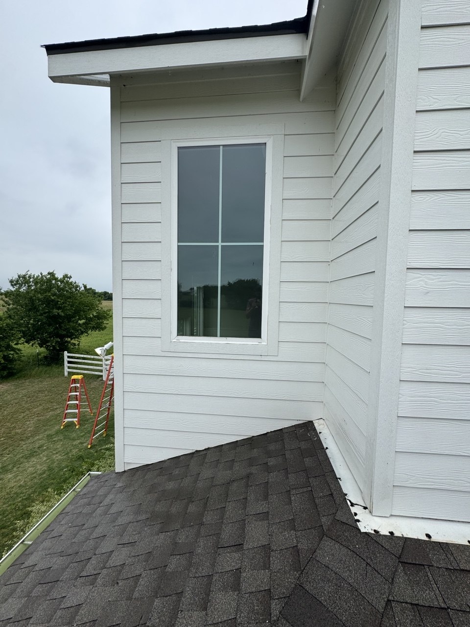 Clean home siding and windows after pressure washing